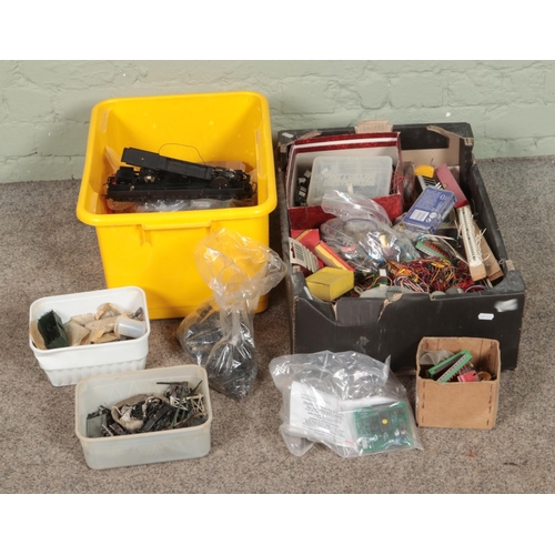 288 - Two boxes of assorted model railway spares and repairs to include wheels, electrics, turnout switche... 