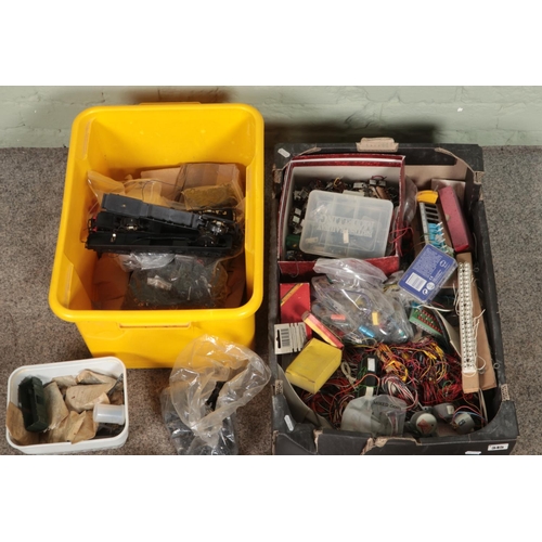 288 - Two boxes of assorted model railway spares and repairs to include wheels, electrics, turnout switche... 