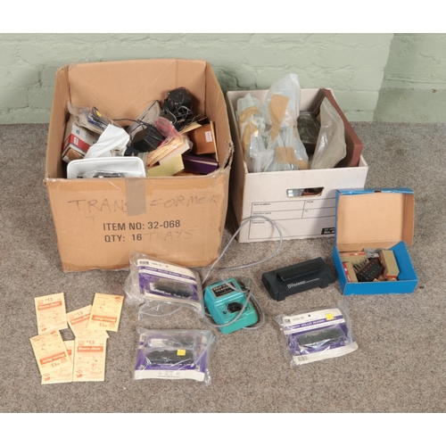 295 - Two boxes of assorted model railway spares and repairs, Kadee HO Gauge spares, Dynamis Command Stati... 