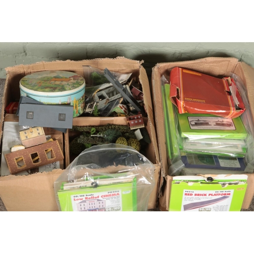 297 - Two boxes of assorted model railway scenery to include buildings, background decor, etc.