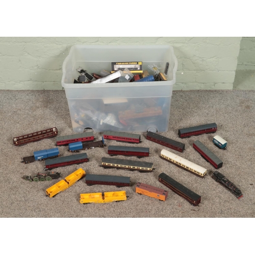 299 - A large box of mostly railway carriages and spares & repairs. Includes motors, bodies, etc.