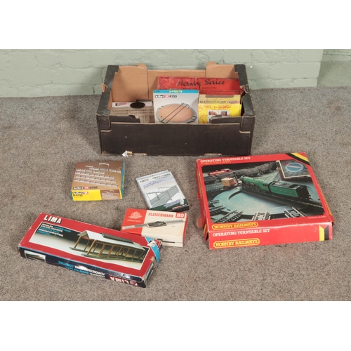 303 - A collection of boxed model railway track and accessories to include Hornby Series, Hornby Operating... 