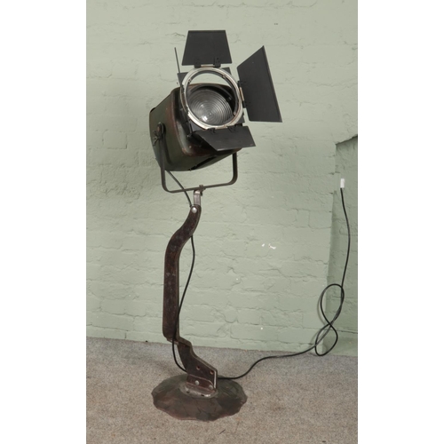 309 - A vintage Strand Electric spotlight on metal stand.