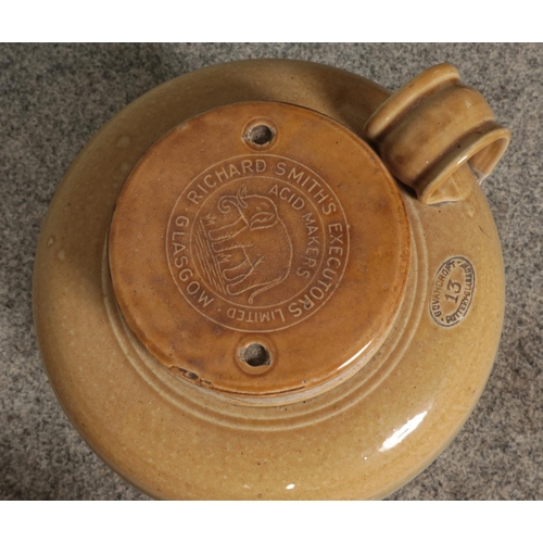 315 - A collection of stoneware, to include four flagons and twin handled bread bin. Including advertising... 