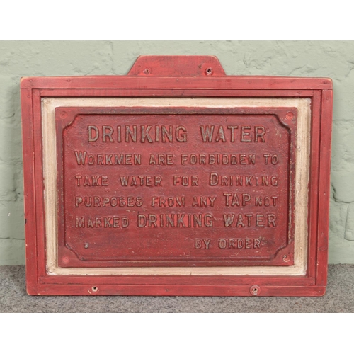 318 - A mounted cast iron 'Drinking Water' sign, possibly of railway interest; stating Workmen are forbidd... 