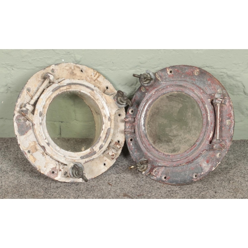 324 - Two cast iron port holes

Dx33cm