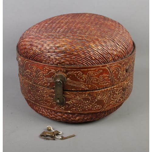 325 - A Chinese round woven wedding basket featuring central band decorated with dragon motifs. With origi... 