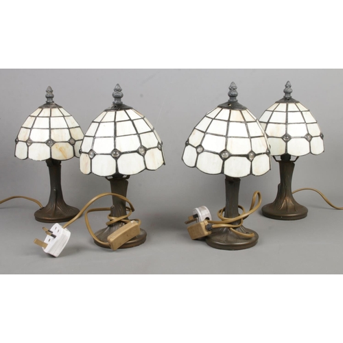 330 - Four small Tiffany style desk lights, with translucent shades.