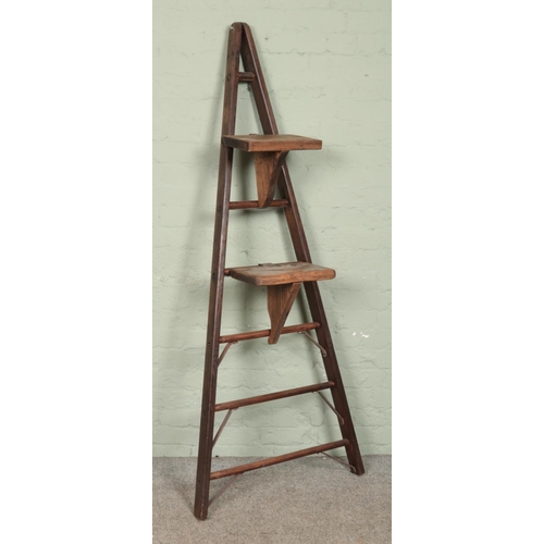 336 - A set of wooden ladders, set with two steps. Possibly used for fruit picking. 178cm tall.