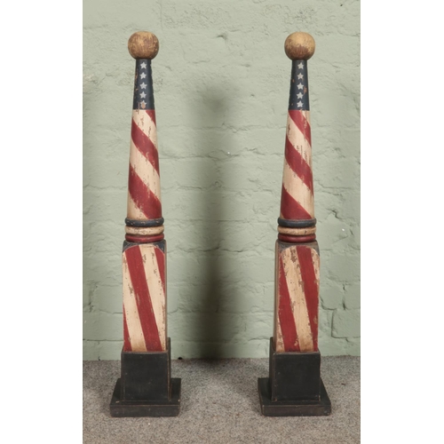 340 - Two reproduction wooden 'barber's poles', with transfer printed American flag colour theme. On squar... 