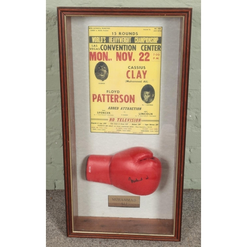 341 - A framed boxing display. Includes promotional poster Cassius Clay vs Floyd Patterson and signed glov... 