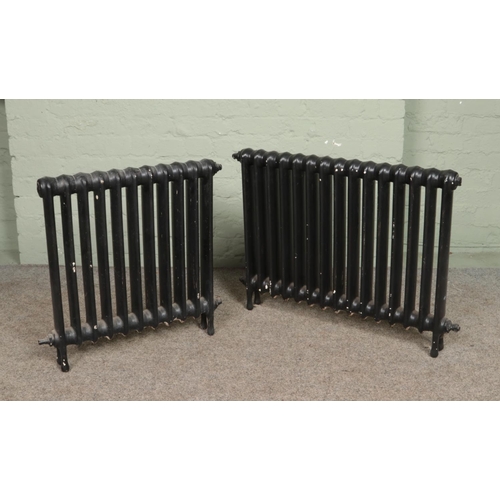 351 - Two painted cast iron radiators; fifteen and eleven bars.