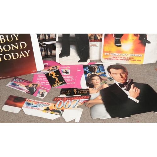 357 - A large collection of James Bond movie advertising and point of sale pieces from various bond films ... 