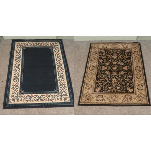 365 - Two rugs; a large blue ground example with floral, cream and Greek key border, with black and olive ... 