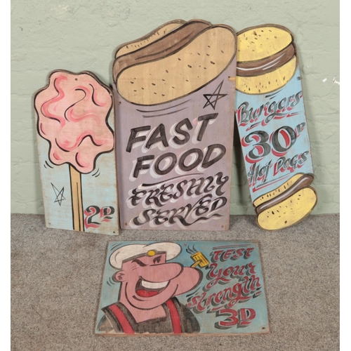 368 - A collection of hand painted fairground signs including Popeye test your strength sign.