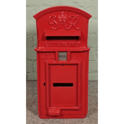 376 - A George VI cast iron hanging postbox, with arched top and makers W.T. Allen and Co. London to the r... 