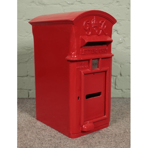 376 - A George VI cast iron hanging postbox, with arched top and makers W.T. Allen and Co. London to the r... 