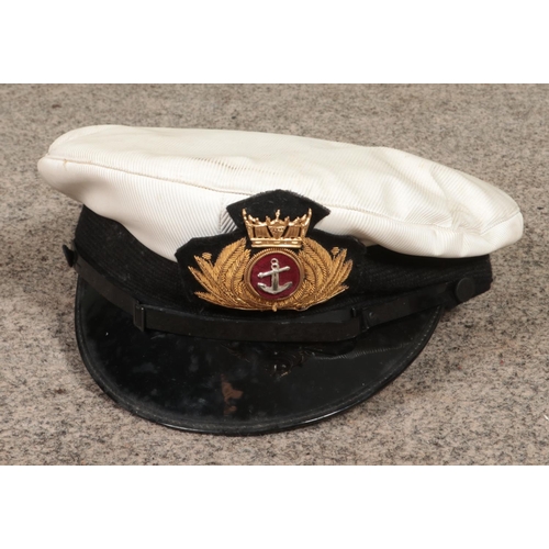 386 - A merchant navy captains peak cap along with jacket and trousers.