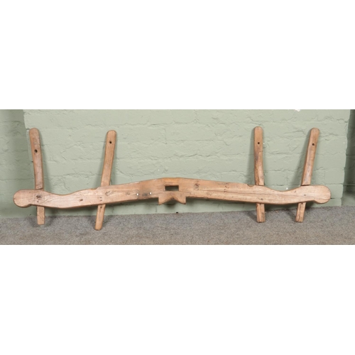 394 - A vintage wooden yoke. Length 163cm.