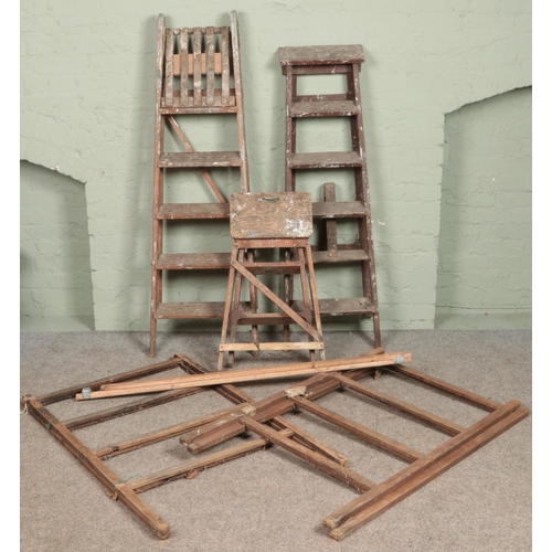 398 - Three sets of wooden step ladders along with two clothes horses.