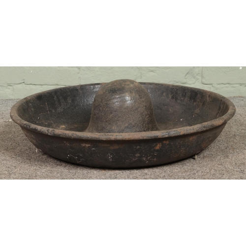 402 - A vintage cast iron Mexican Hat trough. Diameter: 70cm.