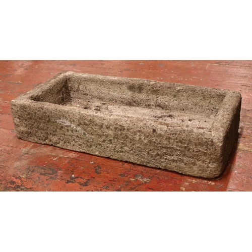 404 - A large concrete garden trough of rectangular form. Height: 19cm Width: 91cm, Depth: 43cm.