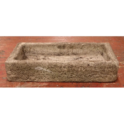 404 - A large concrete garden trough of rectangular form. Height: 19cm Width: 91cm, Depth: 43cm.