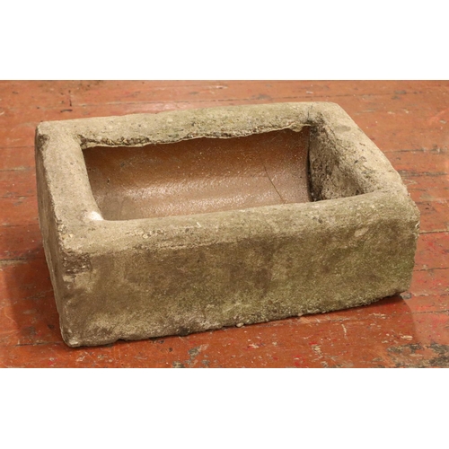 405 - A concrete garden trough, with slanted and raised back. Height: 22cm, Width: 59cm, Depth: 38cm.