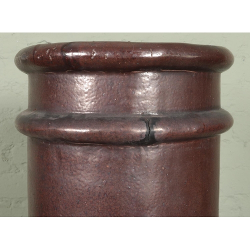 415 - A 19th century 'Long Tom' tall standing chimney pot. Height 151.5cm.