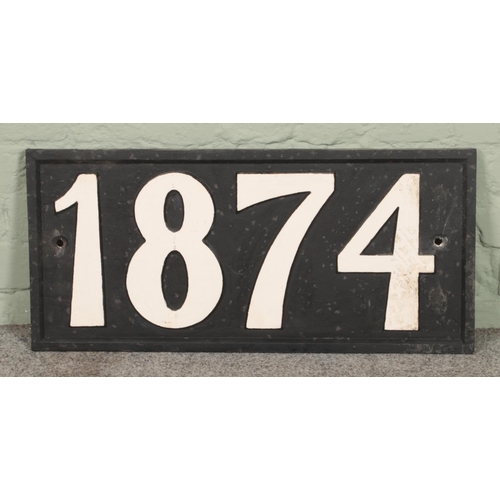 416 - A large cast iron year sign with year 1874. 71x33cm.