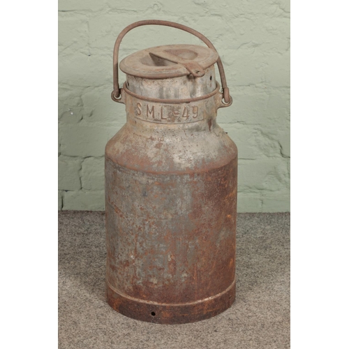 417 - A aluminium milk churn with SML 49 embossed to neck.

Hx56cm approx.