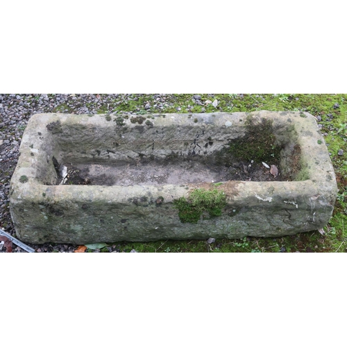 421 - A large stone trough. (H24cm x W102cm x D40cm)