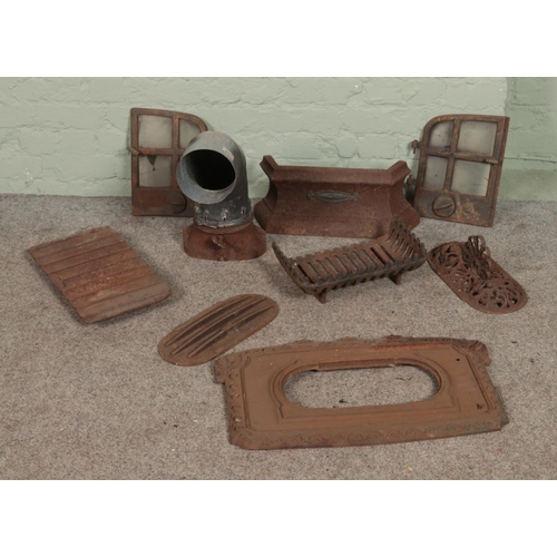 426 - A collection of cast iron fire grate spares to include decorative floral examples.