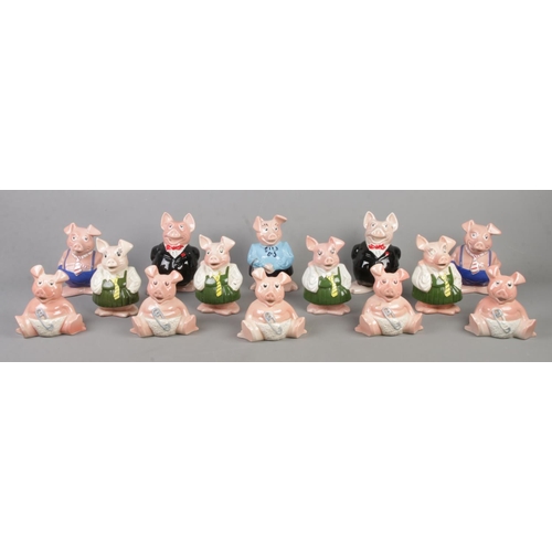 64 - A collection of Wade and similar ceramic Natwest pigs.