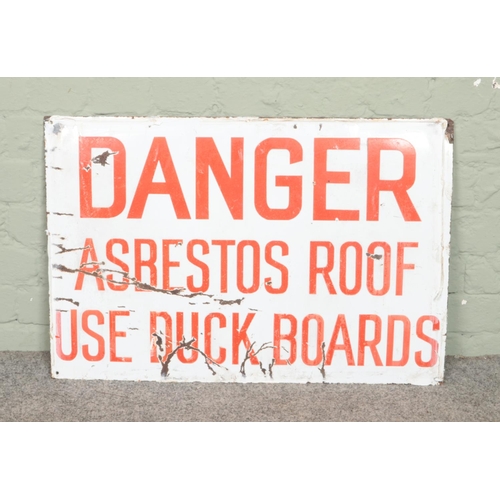 433 - A vintage enamelled sign. 'Danger Asbestos Roof'. 51cm x 76cm.