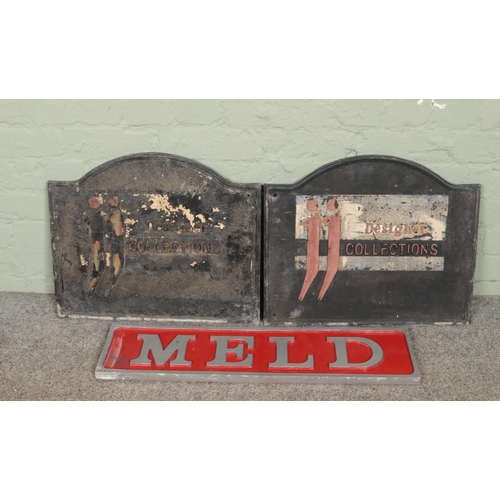 441 - Two cast metal signs for JJ Designer Collections along with a wooden 'Meld' sign.