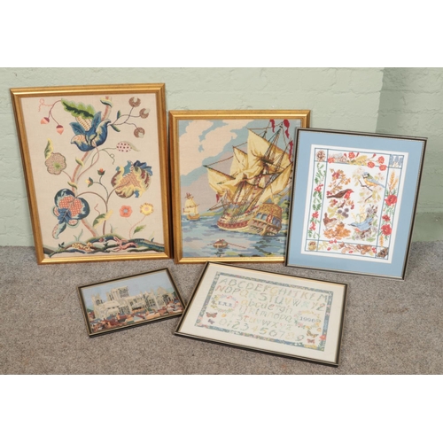 463 - Five framed embroideries. Includes ship scene, floral and bird example, etc.