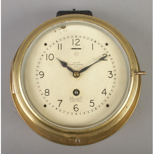 69 - A Mercer (St. Albans, England) 'Octo' brass bulkhead clock. With serial number to surround A.P W6578... 