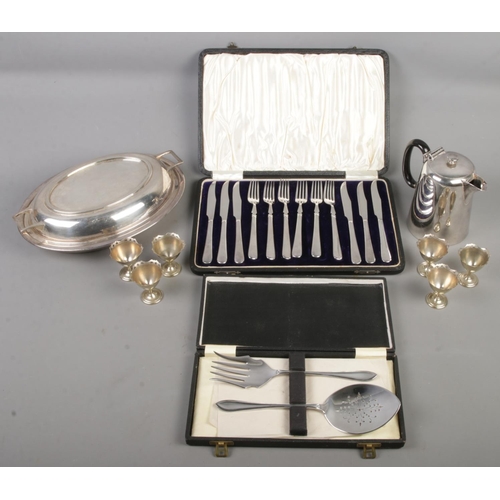 70 - A quantity of metalwares. Includes flatware, tureen, jug, egg cups, etc.