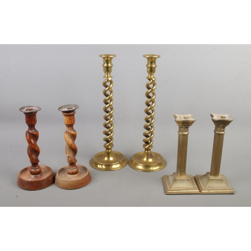 71 - Three pairs of candlesticks, including ecclesiastical style examples with twisted stem. Tallest 34cm... 
