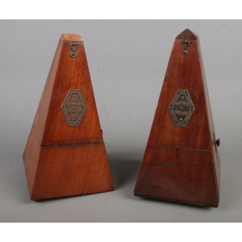 73 - Two mahogany cased metronomes stamped for 'Metronome de Maelzel' and 'Metronome Nach Maelzel'. 22cm ... 