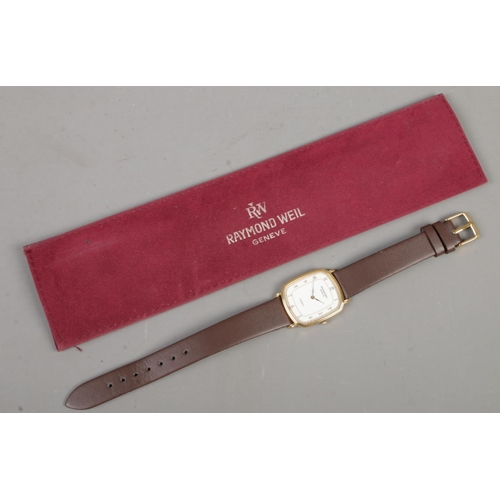 475 - A gold plated Raymond Weil Geneve quartz wristwatch with leather strap and original sleeve.