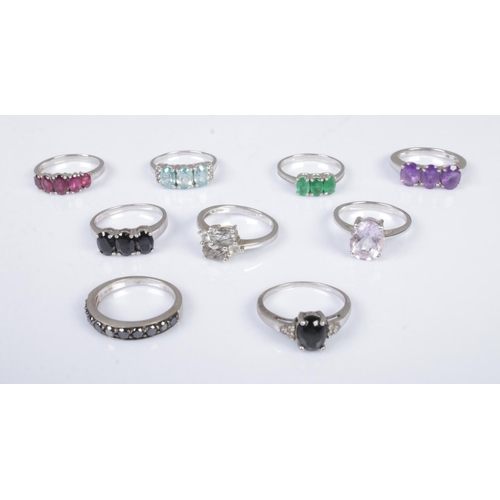 477 - A collection of nine gemstone silver rings to include garnet, amethyst, topaz and star diopside exam... 