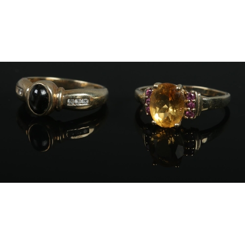 481 - Two 9ct gold rings one set star diopside and topaz (Size N), the other citrine and garnet (Size T). ... 