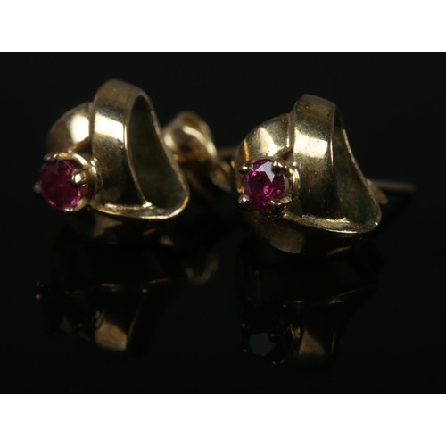 488 - A pair of 9ct gold earrings set with single rubies. Total weight 2.7g.