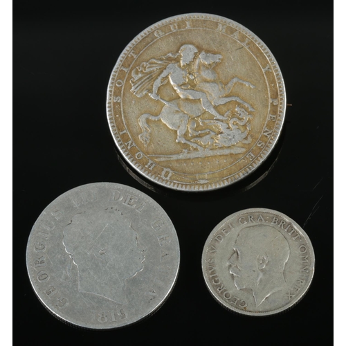 501 - Three silver coins. Includes 1819 George III half crown, George III crown brooch, etc. (48g)