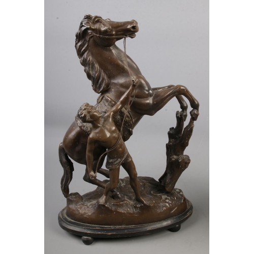 83 - A pair of spelter Marley Horses, 42cm tall. Stamped 'Made in England to the bases.