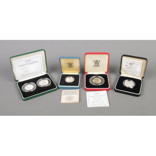 533 - Four cased silver proof coins to include 1997 Fifty Pence two-coin set, Piedfort 50th Anniversary of... 