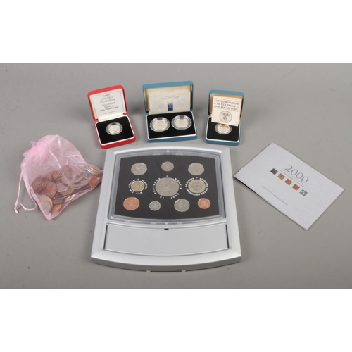 534 - A collection of cased silver proof coin sets to include one pound coin, 1992 ten pence two-coin set ... 