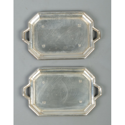 542 - Two twin handled silver pin dishes of rectangular form. Assayed for Sheffield, 1975 by Cooper Brothe... 